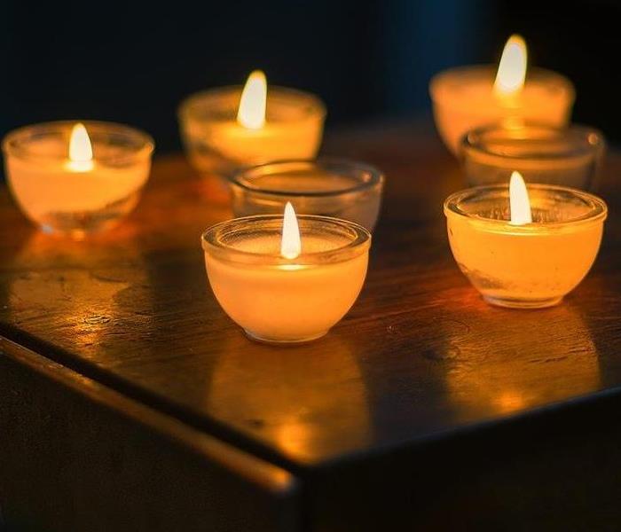 small lit candles in jars