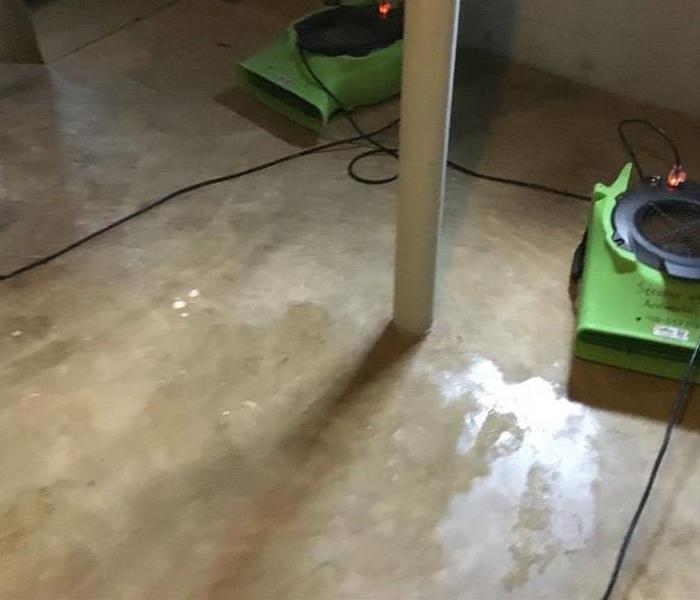 Air Movers drying wet floor